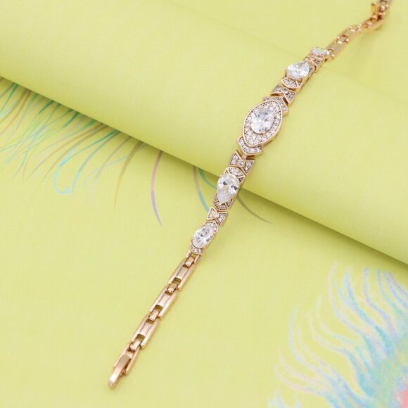 "Elegant Oval-Cut Crystal Rose Gold Bracelet with Bow Accents, XPBL0800 - Picture 1 of 11